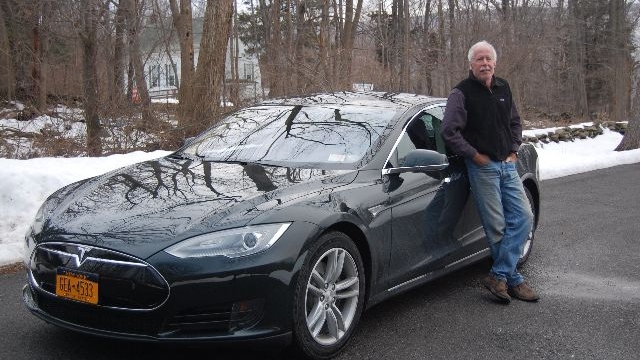 2013 Tesla Model S electric sport sedan on delivery day, with owner David Noland