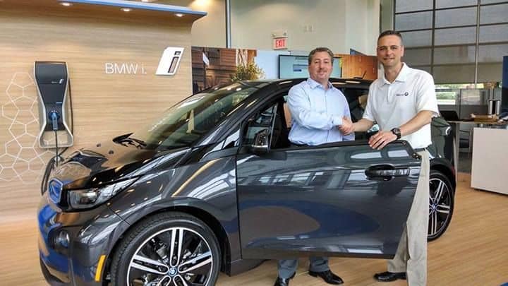 2014 BMW i3 REx range-extended electric car - buyer Tom Moloughney with salesman Manny Antunes