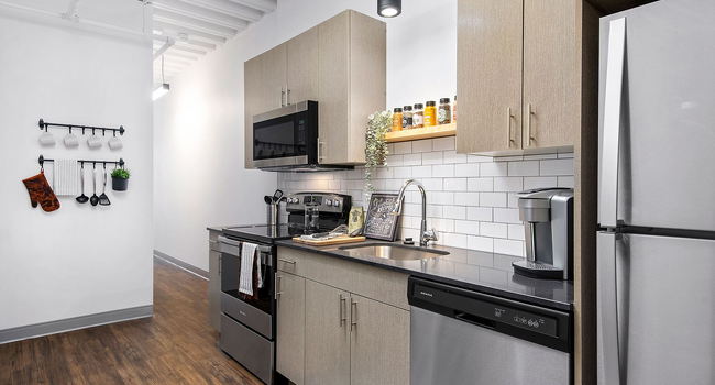 Our pet-friendly 1- and 2-bedroom industrial inspired lofts feature 9-foot, 4-inch ceilings with exposed structure and ductwork. Kitchens feature stone countertops and stainless steel appliances.